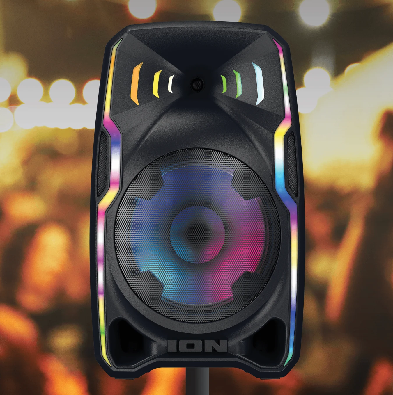 ION Total PA Apex on a stand with warm party lighting